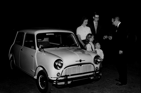 The first Morris Mini-Minor sold in Texas being delivered to a family in Arlington, Texas, in 1959.